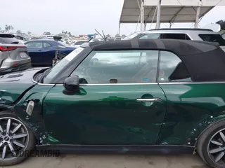 2019 MINI Convertible Cooper S z VIN WMWWG9C5XK3E40620, wystawiony jako IAAI lot #42379122 z przebiegiem 5 496 mil mil oraz . Historia ofert i sprzedaży dostępna na DreamBid. Obrazek 14.