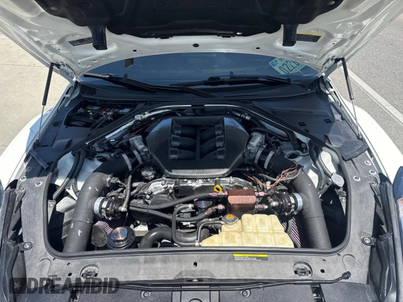2020 Nissan GT-R Premium z VIN JN1AR5EF7LM100066, wystawiony jako Copart lot #58606645 z przebiegiem 35 824 mil mil oraz Szkody całkowita. Historia ofert i sprzedaży dostępna na DreamBid. Obrazek 7.