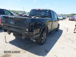 2015 Ford F-150 XLT with VIN 1FTFX1EF1FFC06037, listed as a IAAI auction lot 42525664 with 269,216 mi miles and . Bid and sale history available at DreamBid. Image 4.