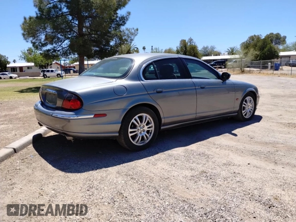 2003 Jaguar S-Type with VIN SAJEA01U93HM78946, listed as a Copart auction lot 54582105 with 132,560 mi miles and Clean Title. Bid and sale history available at DreamBid. Image 4.