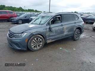 2022 Volkswagen Tiguan S with VIN 3VV1B7AX9NM005125, listed as a IAAI auction lot 42371110 with 94,060 mi miles and . Bid and sale history available at DreamBid. Image 2.