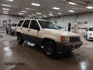1997 Jeep Grand Cherokee Laredo with VIN 1J4GZ58S9VC562907, listed as a IAAI auction lot 42102313 with 137,672 mi miles and . Bid and sale history available at DreamBid. Image 1.
