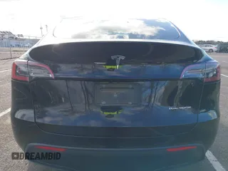 2022 Tesla Model Y Long Range with VIN 7SAYGAEE4NF522330, listed as a IAAI auction lot 42046691 with 59,980 mi miles and . Bid and sale history available at carsss.com. Image 15.