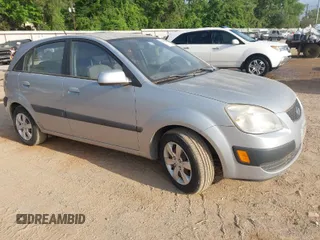 2009 Kia Rio LX with VIN KNADE243896483683, listed as a IAAI auction lot 42061404 with 88,614 mi miles. Bid and sale history available at carsss.com. Image 1.