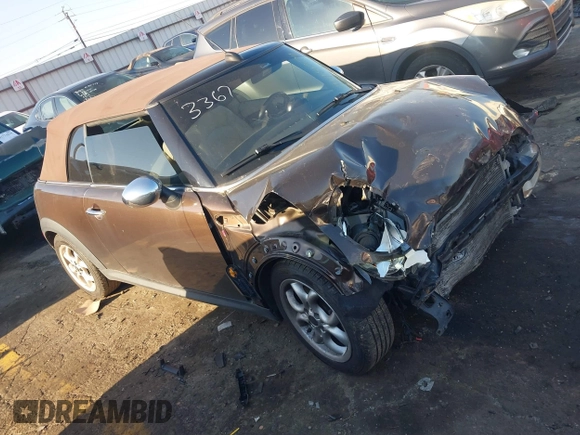 2011 MINI Convertible with VIN WMWZN3C55BT133367, listed as a IAAI auction lot 41781374 with 124,036 mi miles and . Bid and sale history available at DreamBid. Image 13.