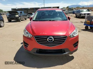 2016 Mazda CX-5 Sport with VIN JM3KE4BYXG0702655, listed as a Copart auction lot 63120205 with 64,403 mi miles and Salvage title. Bid and sale history available at DreamBid. Image 5.