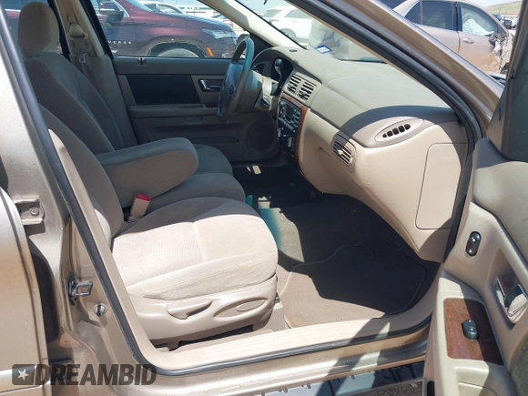2003 Mercury Sable GS z VIN 1MEFM50U23A601955, wystawiony jako IAAI lot #42197171 z przebiegiem 94 977 mil mil oraz . Historia ofert i sprzedaży dostępna na DreamBid. Obrazek 5.