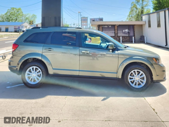 2017 Dodge Journey SXT with VIN 3C4PDCBG4HT598882, listed as a Copart auction lot 56783495 with 89,771 mi miles and Salvage Title. Bid and sale history available at DreamBid. Image 7.