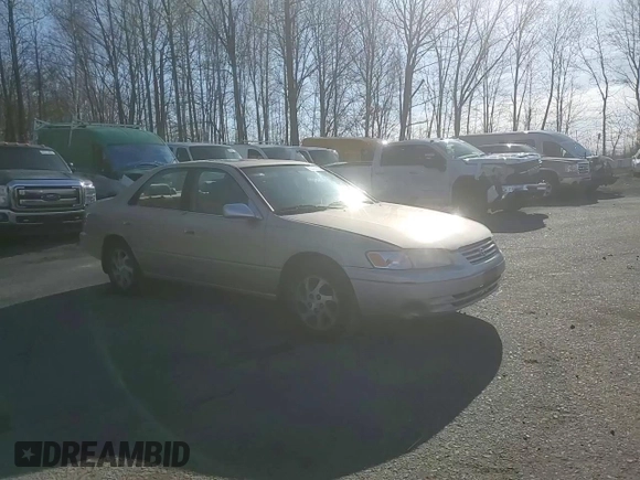 1999 Toyota Camry LE z VIN JT2BF22K4X0199123, wystawiony jako Copart lot #53456665 z przebiegiem 181 526 mil mil oraz Szkoda całkowita • Salvage title. Historia ofert i sprzedaży dostępna na DreamBid. Obrazek 14.