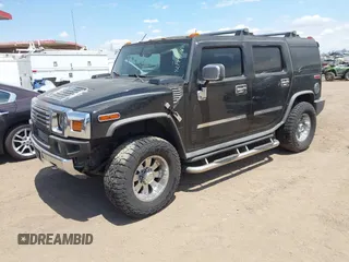 2003 Hummer H2 with VIN 5GRGN23U73H122756, listed as a IAAI auction lot 42194176 with 239,411 mi miles. Bid and sale history available at carsss.com. Image 17.