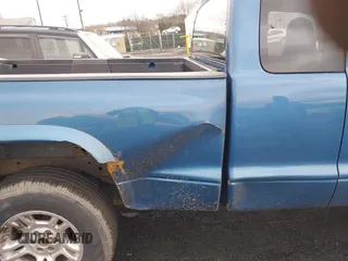 2003 Dodge Dakota Sport with VIN 1D7HG32NX3S322085, listed as a IAAI auction lot 41780125 with 95,321 mi miles. Bid and sale history available at carsss.com. Image 6.