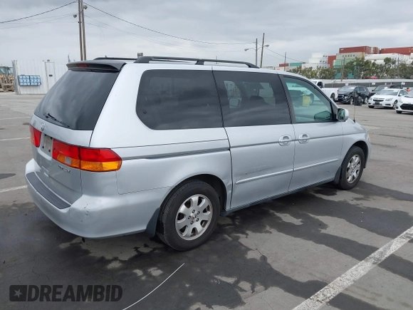 2003 Honda Odyssey EX-L with VIN 5FNRL18943B030373, listed as a IAAI auction lot 41867289 with 179,718 mi miles and . Bid and sale history available at DreamBid. Image 4.