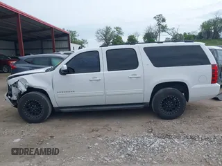 2013 Chevrolet Suburban LT with VIN 1GNSCJE05DR147101, listed as a IAAI auction lot 42336950 with 147,429 mi miles and . Bid and sale history available at DreamBid. Image 15.