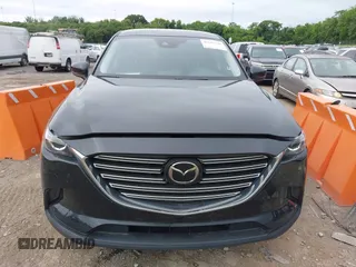2021 Mazda CX-9 Sport with VIN JM3TCABY6M0522352, listed as a IAAI auction lot 42613136 with 106,167 mi miles and . Bid and sale history available at DreamBid. Image 12.