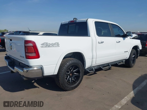 2021 Ram 1500 Laramie with VIN 1C6SRFJT7MN719238, listed as a IAAI auction lot 42482214 with 47,265 mi miles and . Bid and sale history available at DreamBid. Image 4.