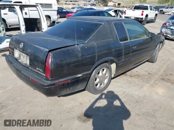 2001 Cadillac Eldorado Touring ETC z VIN 1G6ET12911B103774, wystawiony jako IAAI lot #41998828 z przebiegiem 128 724 mil mil oraz . Historia ofert i sprzedaży dostępna na DreamBid. Obrazek 4.