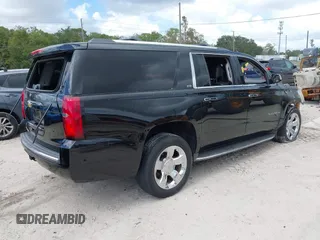 2015 Chevrolet Suburban LTZ with VIN 1GNSCKKC8FR156706, listed as a IAAI auction lot 40638221 with Not Provided miles and . Bid and sale history available at DreamBid. Image 4.