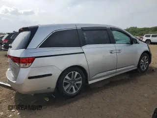 2014 Honda Odyssey Touring with VIN 5FNRL5H93EB034263, listed as a Copart auction lot 57254485 with 150,084 mi miles and Salvage title. Bid and sale history available at DreamBid. Image 3.