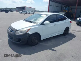 2014 Hyundai Accent GLS with VIN KMHCT4AE1EU590386, listed as a IAAI auction lot 42155202 with 248,545 mi miles. Bid and sale history available at carsss.com. Image 2.