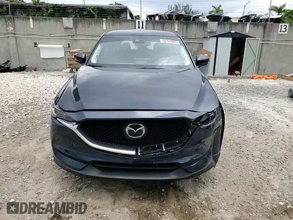 2021 Mazda CX-5 Grand Touring z VIN JM3KFBDM5M0464611, wystawiony jako Copart lot #62829065 z przebiegiem 20 525 mil mil oraz Nie do naprawy • Non repairable. Historia ofert i sprzedaży dostępna na DreamBid. Obrazek 14.