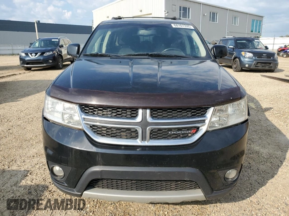 2015 Dodge Journey SXT with VIN 3C4PDCCG5FT559021, listed as a Copart auction lot 60101335 with 323,930 mi miles and Salvage title. Bid and sale history available at DreamBid. Image 5.