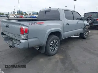2021 Toyota Tacoma SR with VIN 3TMCZ5AN2MM405869, listed as a IAAI auction lot 42094533 with 78,449 mi miles and . Bid and sale history available at DreamBid. Image 4.