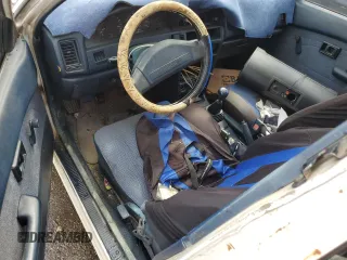 1990 Toyota Corolla z VIN JT2AE94A5L3323663, wystawiony jako Copart lot #71963834 z przebiegiem 354 386 mil mil oraz Szkoda całkowita • Salvage title. Historia ofert i sprzedaży dostępna na DreamBid. Obrazek 8.