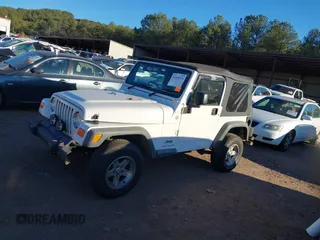 2004 Jeep Wrangler Sport Right Hand Drive with VIN 1J4F449S74P732854, listed as a IAAI auction lot 41408316 with 112,064 mi miles. Bid and sale history available at carsss.com. Image 14.