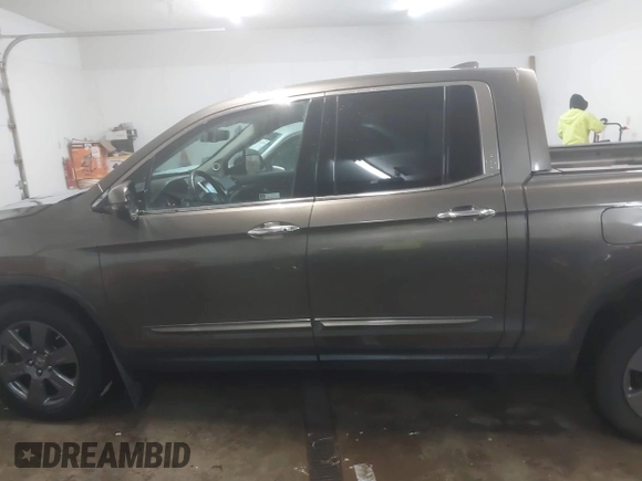 2020 Honda Ridgeline RTL-E with VIN 5FPYK3F75LB001516, listed as a IAAI auction lot 41605859 with 93,902 mi miles and . Bid and sale history available at DreamBid. Image 14.