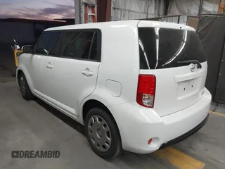 2014 Scion xB with VIN JTLZE4FE1EJ060281, listed as a IAAI auction lot 41477386 with 61,423 mi miles. Bid and sale history available at carsss.com. Image 3.
