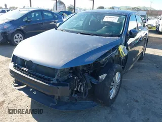 2015 Volkswagen Passat 1.8T Wolfsburg Ed with VIN 1VWAT7A3XFC010262, listed as a IAAI auction lot 41860210 with 99,775 mi miles. Bid and sale history available at carsss.com. Image 2.