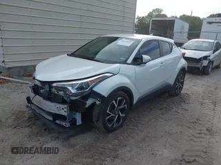 2018 Toyota C-HR XLE with VIN JTNKHMBX3J1010211, listed as a IAAI auction lot 40799443 with 104,148 mi miles. Bid and sale history available at carsss.com. Image 18.