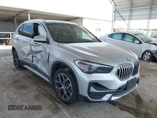 2021 BMW X1 xDrive28i z VIN WBXJG9C00M5T03209, wystawiony jako IAAI lot #42476313 z przebiegiem 35 348 mil mil oraz . Historia ofert i sprzedaży dostępna na DreamBid. Obrazek 1.