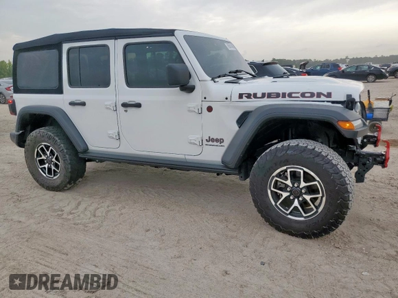 2024 Jeep Wrangler Rubicon with VIN 1C4PJXFG2RW266901, listed as a Copart auction lot 60641445 with 3,908 mi miles and Salvage title. Bid and sale history available at DreamBid. Image 4.