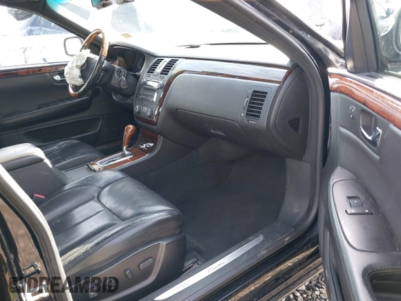 2006 Cadillac DTS 1SC z VIN 1G6KD57YX6U100634, wystawiony jako IAAI lot #41671007 z przebiegiem Nie podano mil oraz . Historia ofert i sprzedaży dostępna na DreamBid. Obrazek 5.