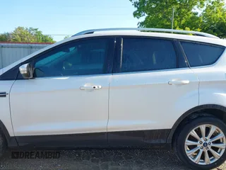 2017 Ford Escape Titanium with VIN 1FMCU0J90HUC51244, listed as a IAAI auction lot 42206165 with 106,847 mi miles and . Bid and sale history available at DreamBid. Image 14.