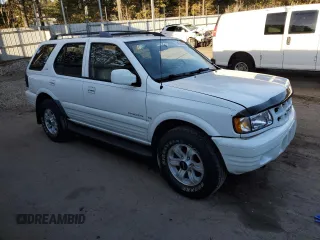 2000 Isuzu Rodeo S z VIN 4S2CK58W8Y4340907, wystawiony jako Copart lot #79683804 z przebiegiem 153 419 mil mil oraz Szkoda całkowita • Salvage title. Historia ofert i sprzedaży dostępna na DreamBid. Obrazek 4.