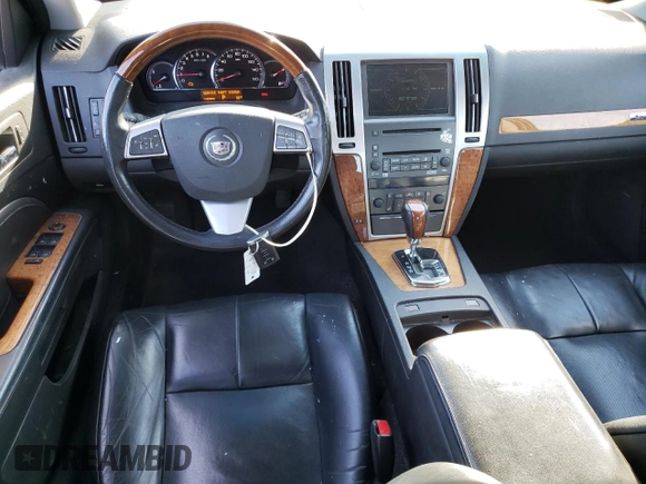 2009 Cadillac STS AWD z VIN 1G6DD67VX90138316, wystawiony jako Copart lot #80915524 z przebiegiem 112 290 mil mil oraz Czysty tytuł • Clean title. Historia ofert i sprzedaży dostępna na DreamBid. Obrazek 8.