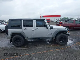 2007 Jeep Wrangler Unlimited X with VIN 1J4GA39187L209448, listed as a IAAI auction lot 42104328 with 138,302 mi miles and . Bid and sale history available at DreamBid. Image 13.
