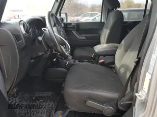2018 Jeep Wrangler JK Unlimited Sport S with VIN 1C4BJWDG2JL908286, listed as a Copart auction lot 77313844 with 69,497 mi miles and Salvage Title. Bid and sale history available at carsss.com. Image 7.
