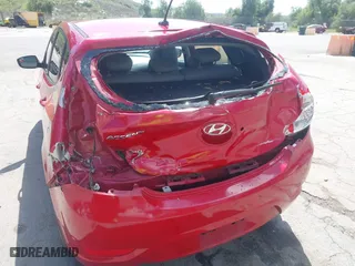 2014 Hyundai Accent GS with VIN KMHCT5AE9EU174866, listed as a IAAI auction lot 41948180 with 117,985 mi miles. Bid and sale history available at carsss.com. Image 12.