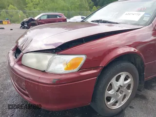 2000 Toyota Camry CE z VIN JT2BG22K3Y0521541, wystawiony jako IAAI lot #42074772 z przebiegiem 144 587 mil mil oraz . Historia ofert i sprzedaży dostępna na DreamBid. Obrazek 19.