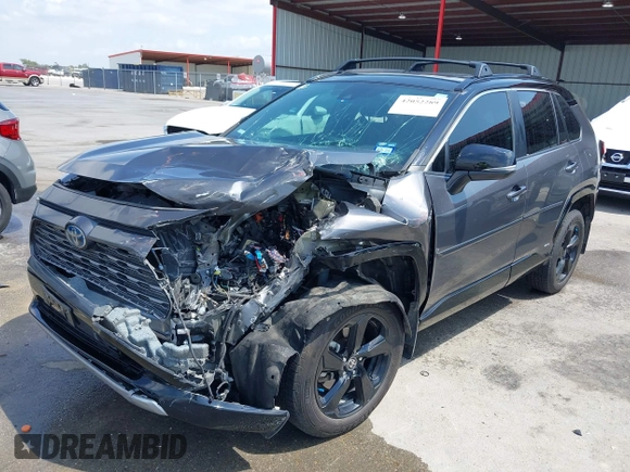 2021 Toyota RAV4 Hybrid XSE with VIN 2T3E6RFV8MW026973, listed as a IAAI auction lot 42052289 with 94,857 mi miles and . Bid and sale history available at DreamBid. Image 2.