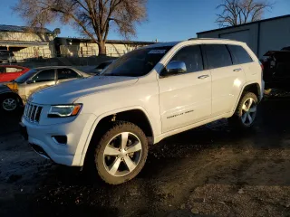 2016 Jeep Grand Cherokee Overland with VIN 1C4RJFCT3GC338613, listed as a Copart auction lot 41695025 with 143,703 mi miles and Salvage title. Bid and sale history available at DreamBid. Image 1.