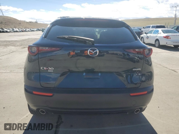 2023 Mazda CX-30 S Carbon Edition z VIN 3MVDMBCM3PM554378, wystawiony jako Copart lot #50558075 z przebiegiem 26 658 mil mil oraz Szkoda całkowita • Salvage title. Historia ofert i sprzedaży dostępna na DreamBid. Obrazek 6.