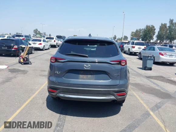 2022 Mazda CX-9 Grand Touring with VIN JM3TCBDY1N0611766, listed as a IAAI auction lot 42452059 with 60,755 mi miles and . Bid and sale history available at DreamBid. Image 16.