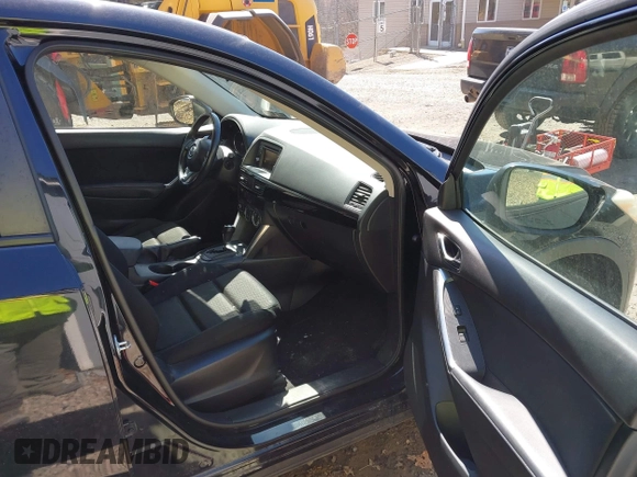 2014 Mazda CX-5 Touring with VIN JM3KE4CY8E0333029, listed as a IAAI auction lot 41857199 with 218,887 mi miles. Bid and sale history available at carsss.com. Image 5.