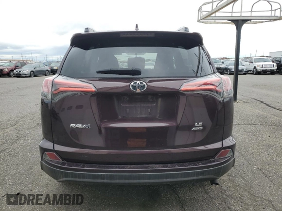 2016 Toyota RAV4 LE with VIN 2T3BFREV3GW490181, listed as a Copart auction lot 52457435 with 128,267 mi miles and Salvage Title. Bid and sale history available at DreamBid. Image 6.