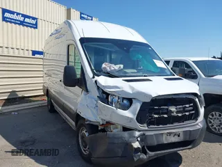 2019 Ford Transit z VIN 1FTBW3XMXKKB74344, wystawiony jako IAAI lot #42131484 z przebiegiem 181 395 mil mil oraz . Historia ofert i sprzedaży dostępna na DreamBid. Obrazek 1.