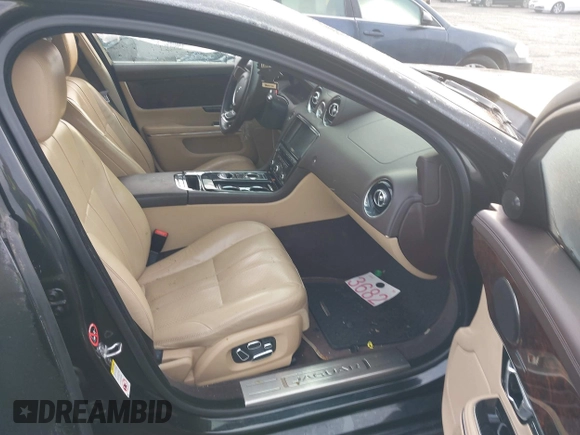 2014 Jaguar XJ with VIN SAJWA1CZXE8V74400, listed as a IAAI auction lot 38250698 with 102,205 mi miles and . Bid and sale history available at DreamBid. Image 5.